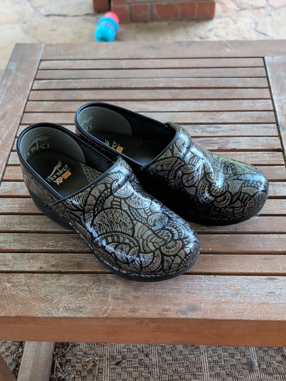 Dansko XP Black Iridescent Floral Patent Clogs